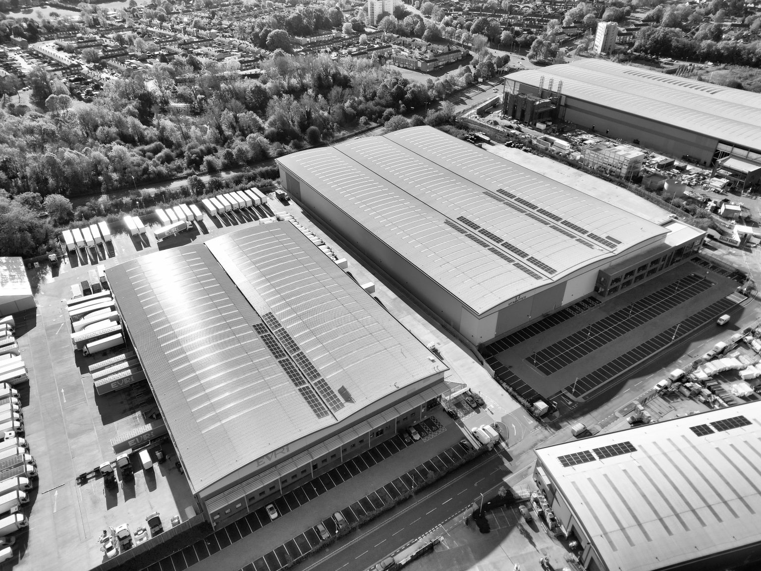 Aerial view of large distribution centres in a supply chain network